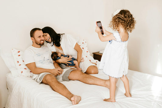 Mother breastfeeding in family